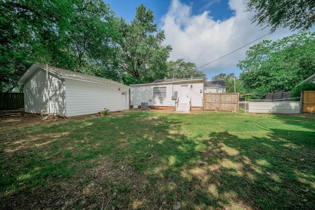 1021 N Montgomery St, Gilmer, TX 75644 - back of property featuring entry steps and an outbuilding