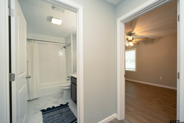 1021 N Montgomery St, Gilmer, TX 75644 - bathroom featuring vanity, shower / bath combo, ceiling fan, and marble look tiles