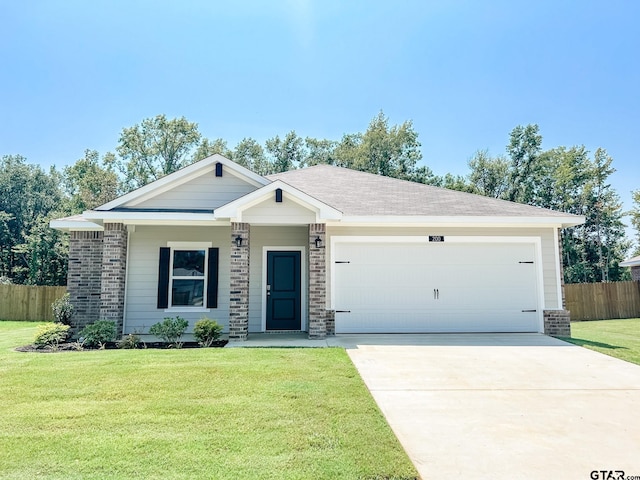 ranch-style home with a garage and a front yard