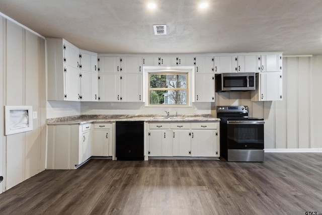 kitchen with stainless steel appliances, sink, backsplash, white cabinets, and dark hardwood / wood-style floors