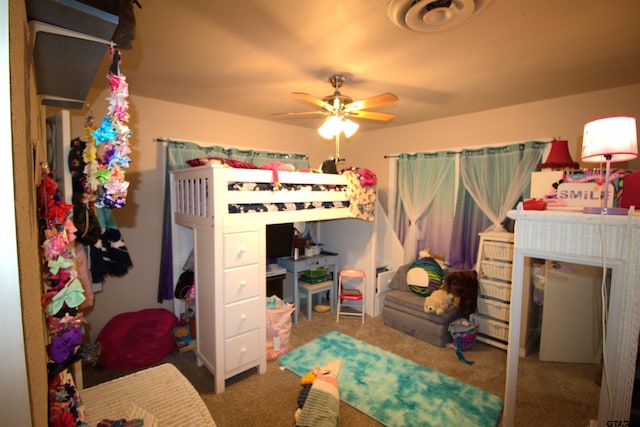 carpeted bedroom with a ceiling fan