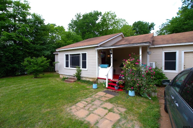 view of front of house with a porch and a front yard