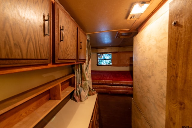 interior space with a textured ceiling