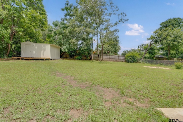 304 Hanks St, Whitehouse, TX 75791 - fenced backyard with a storage unit