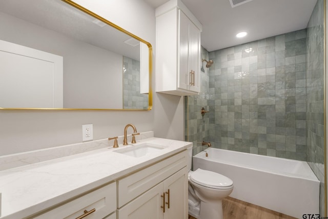 304 Hanks St, Whitehouse, TX 75791 - full bathroom featuring vanity, wood finished floors, washtub / shower combination, and recessed lighting
