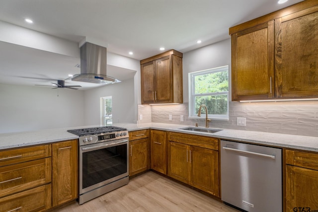 304 Hanks St, Whitehouse, TX 75791 - kitchen with stainless steel appliances, island exhaust hood, light wood-style flooring, light stone countertops, and recessed lighting