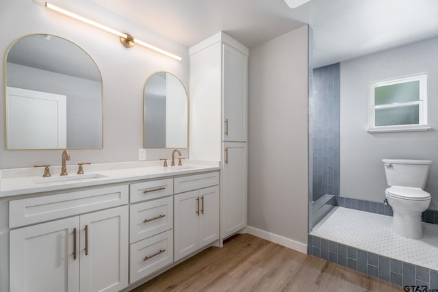 304 Hanks St, Whitehouse, TX 75791 - full bath featuring double vanity, wood finished floors, and a tile shower