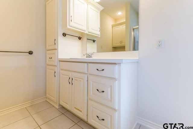 full bath featuring tile patterned flooring, vanity, baseboards, and recessed lighting