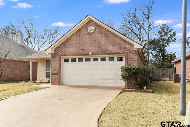 view of front facade with an attached garage, cooling unit, brick siding, fence, and concrete driveway