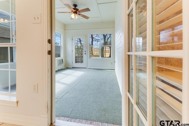 interior space featuring ceiling fan