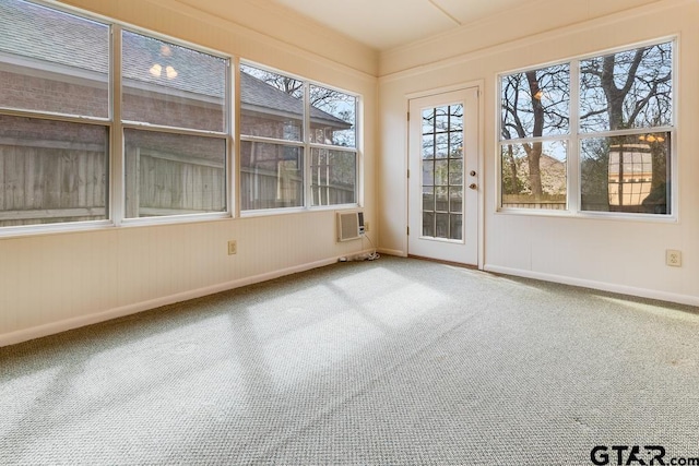 unfurnished sunroom featuring a wall mounted air conditioner