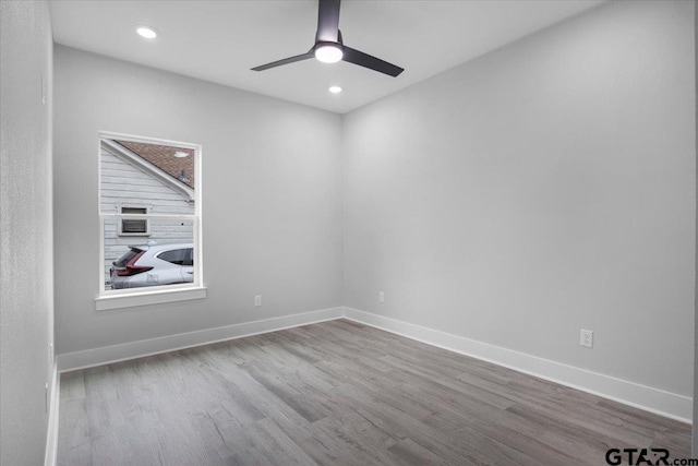 spare room with ceiling fan and light hardwood / wood-style floors