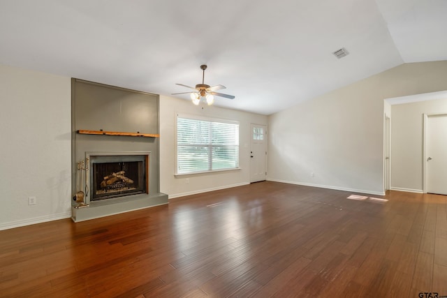 unfurnished living room featuring ceiling fan, lofted ceiling, and dark hardwood / wood-style floors