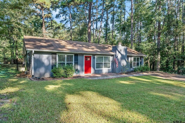 single story home featuring a front yard