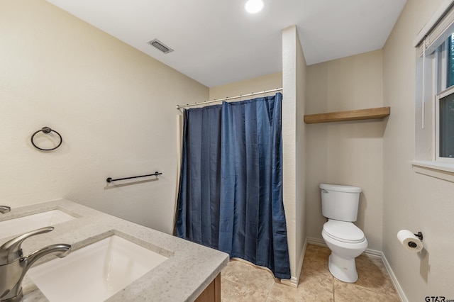 bathroom with toilet, a shower with curtain, vanity, and tile patterned flooring