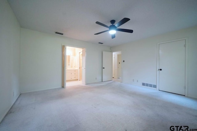 4505 Inverness, Tyler, TX 75703 - unfurnished bedroom featuring carpet floors, ensuite bath, baseboards, and ceiling fan