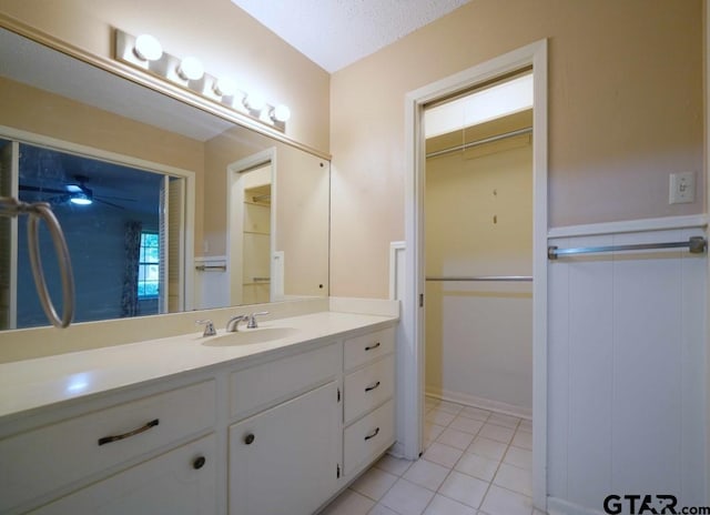 4505 Inverness, Tyler, TX 75703 - bathroom with tile patterned flooring, vanity, and a walk in closet