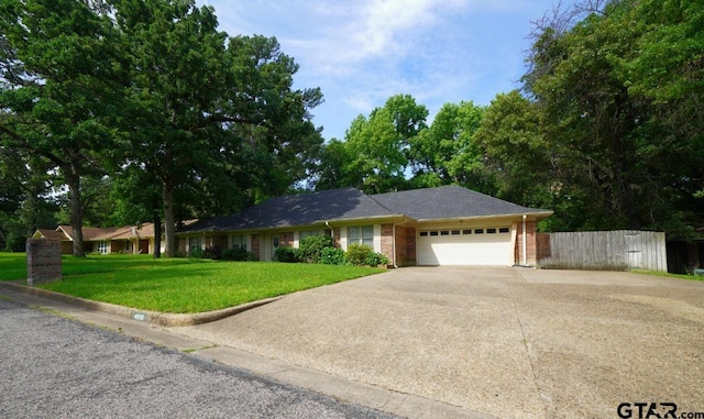 4505 Inverness, Tyler, TX 75703 - ranch-style house featuring a garage, concrete driveway, and brick siding