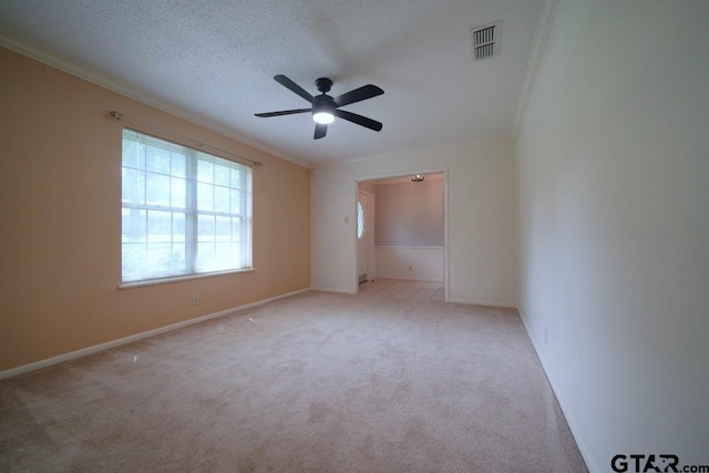 4505 Inverness, Tyler, TX 75703 - carpeted spare room with crown molding, a ceiling fan, baseboards, and a textured ceiling