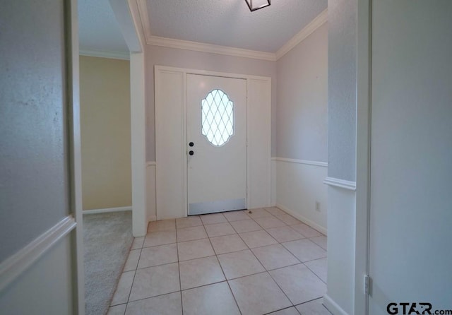 4505 Inverness, Tyler, TX 75703 - entrance foyer with crown molding, a textured ceiling, light tile patterned flooring, and baseboards