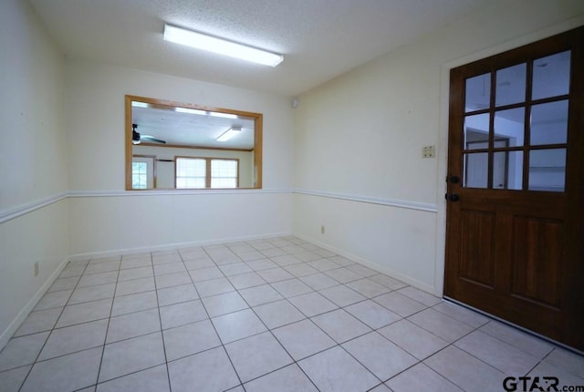4505 Inverness, Tyler, TX 75703 - spare room with baseboards, light tile patterned flooring, and a ceiling fan