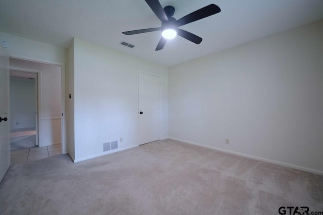 4505 Inverness, Tyler, TX 75703 - unfurnished bedroom featuring carpet flooring, baseboards, a ceiling fan, and a closet