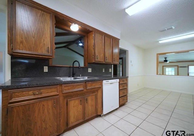 4505 Inverness, Tyler, TX 75703 - kitchen featuring white dishwasher, a sink, ceiling fan, decorative backsplash, and dark countertops