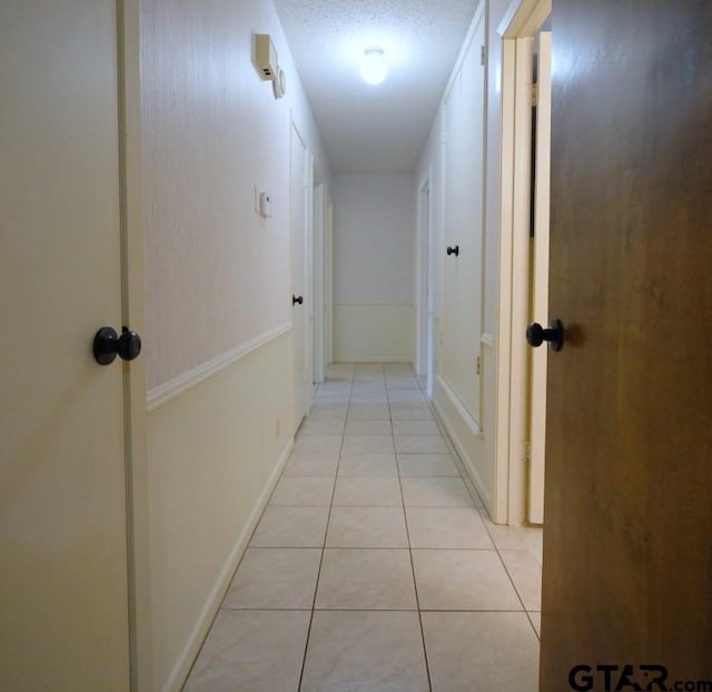 4505 Inverness, Tyler, TX 75703 - hallway with light tile patterned floors
