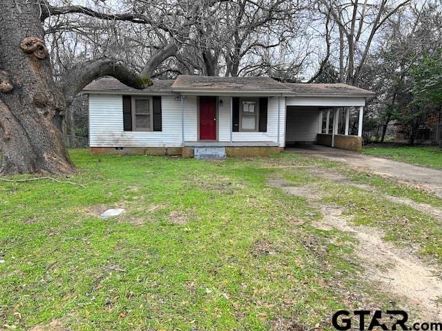 single story home with a carport and a front lawn