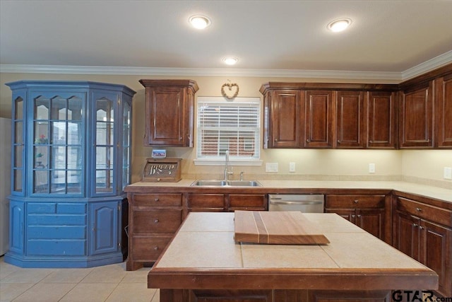 kitchen featuring light tile patterned flooring, dark brown cabinetry, sink, stainless steel dishwasher, and ornamental molding