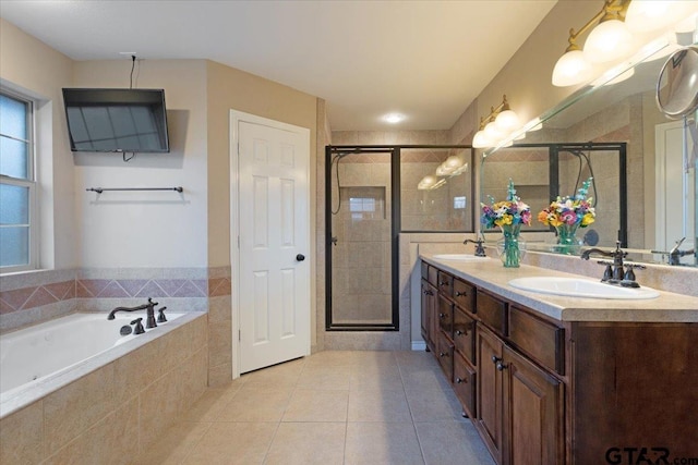 bathroom with vanity, tile patterned floors, and plus walk in shower