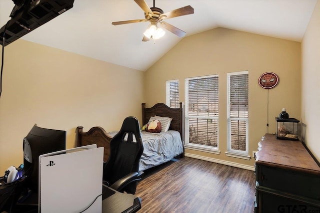 bedroom with dark hardwood / wood-style flooring, vaulted ceiling, and ceiling fan