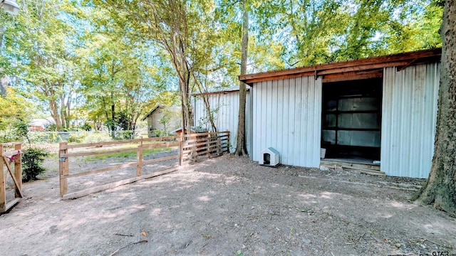 view of outdoor structure with an outdoor structure and fence