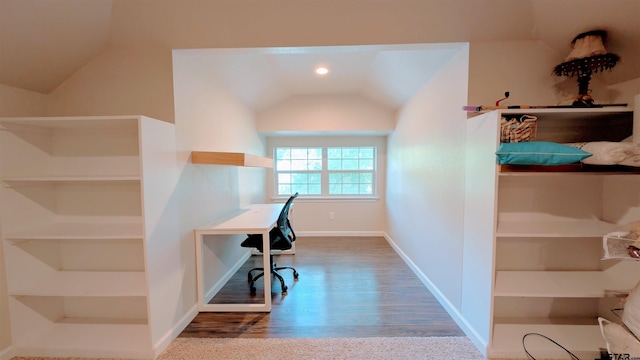 office space with baseboards, vaulted ceiling, and wood finished floors