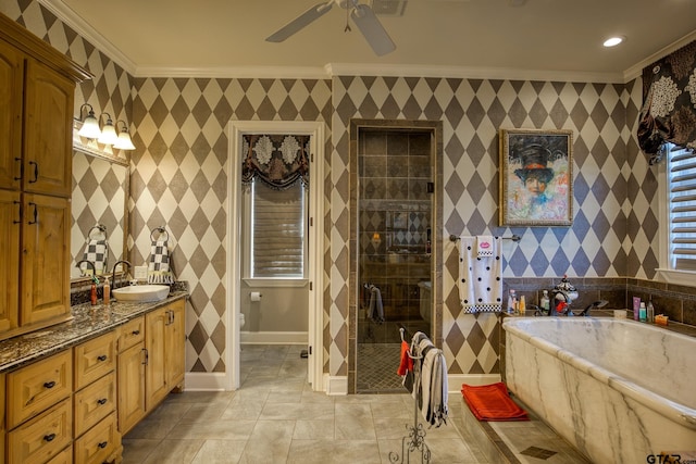 bathroom featuring vanity, separate shower and tub, ceiling fan, and ornamental molding