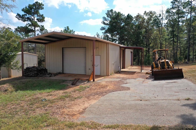 view of outbuilding with a garage