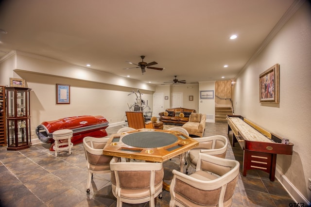 playroom featuring ceiling fan and ornamental molding