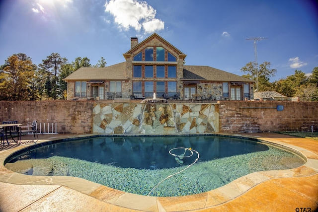 view of swimming pool with a patio area