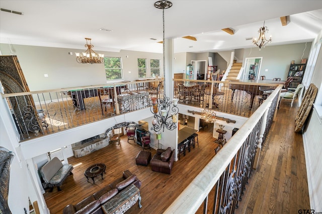 interior space with hardwood / wood-style floors and a chandelier