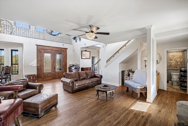 living room featuring ceiling fan and wood-type flooring