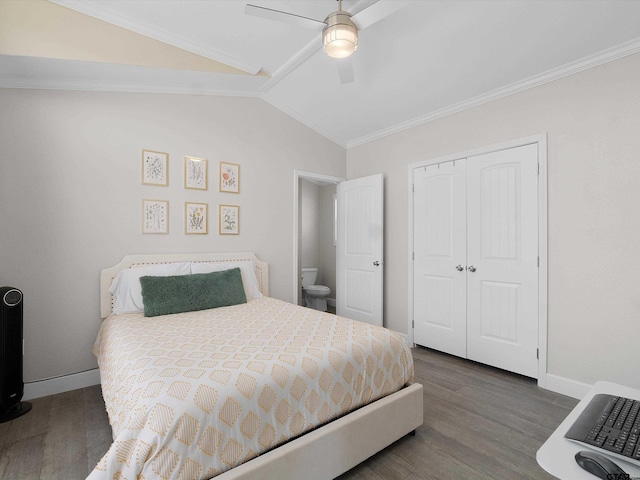 bedroom featuring crown molding, ceiling fan, dark hardwood / wood-style floors, vaulted ceiling, and a closet