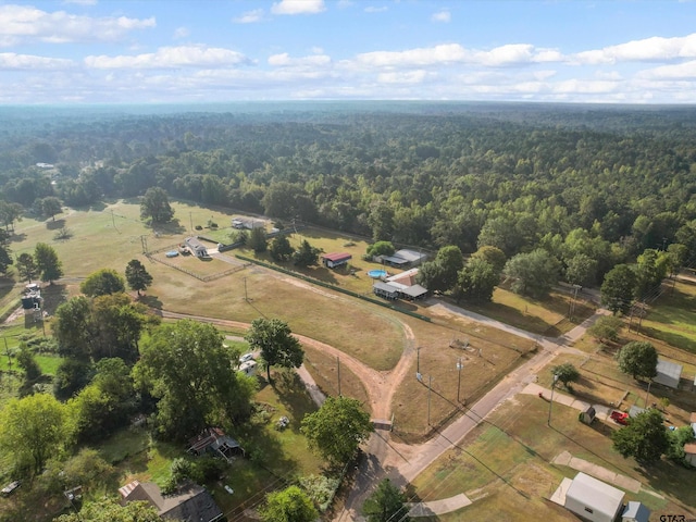 birds eye view of property with a rural view