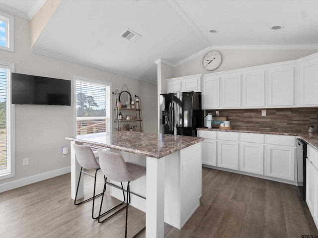 kitchen featuring a center island, white cabinets, and black appliances