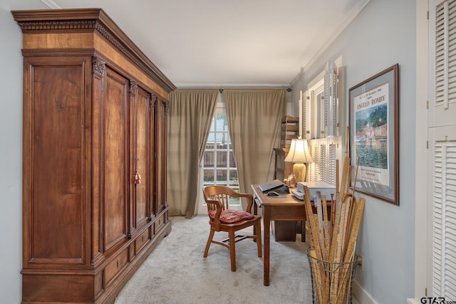 office area with baseboards, light carpet, and ornamental molding