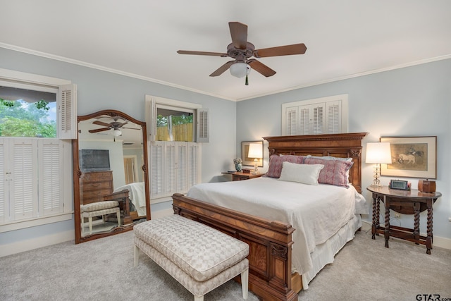 bedroom with a ceiling fan, baseboards, light colored carpet, and ornamental molding