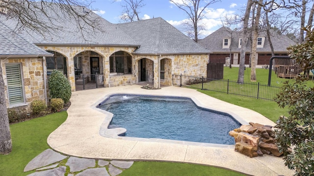 view of swimming pool featuring fence private yard, a fenced in pool, a lawn, and a patio