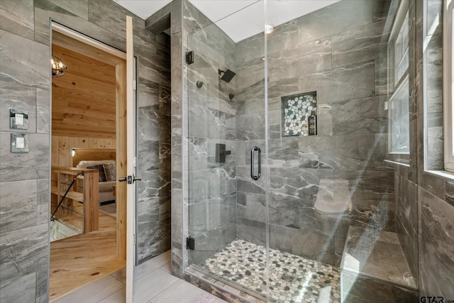 full bathroom with a stall shower and a sauna