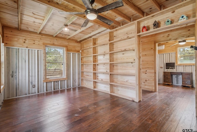 empty room with wood-type flooring, wood ceiling, and ceiling fan
