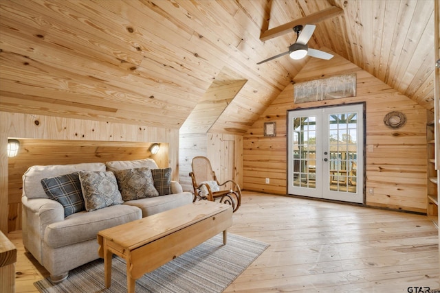 sitting room with wood ceiling, lofted ceiling, light wood-type flooring, and wooden walls