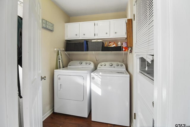 laundry room with dark wood finished floors, cabinet space, and independent washer and dryer